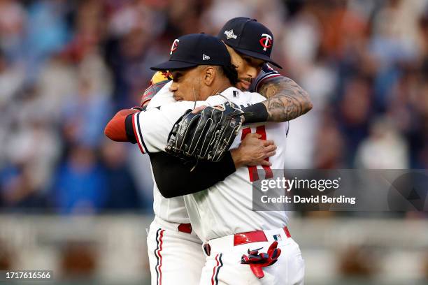 Carlos Correa and Jorge Polanco of the Minnesota Twins celebrate after defeating the Toronto Blue Jays in Game Two to win the Wild Card Series at...