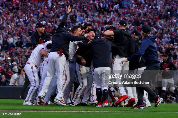 The Minnesota Twins celebrate after defeating the Toronto Blue Jays in Game Two to win the Wild Card Series at Target Field on October 04, 2023 in...