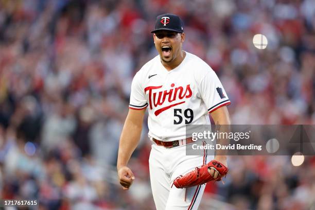Jhoan Duran of the Minnesota Twins celebrates after defeating the Toronto Blue Jays in Game Two to win the Wild Card Series at Target Field on...