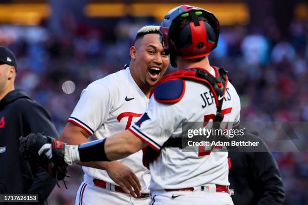 Jhoan Duran and Ryan Jeffers of the Minnesota Twins celebrate after defeating the Toronto Blue Jays in Game Two to win the Wild Card Series at Target...