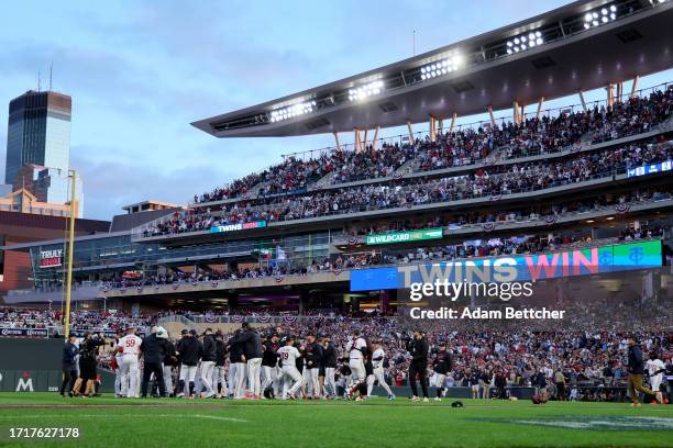 The Minnesota Twins celebrate after defeating the Toronto Blue Jays in Game Two to win the Wild Card Series at Target Field on October 04, 2023 in...