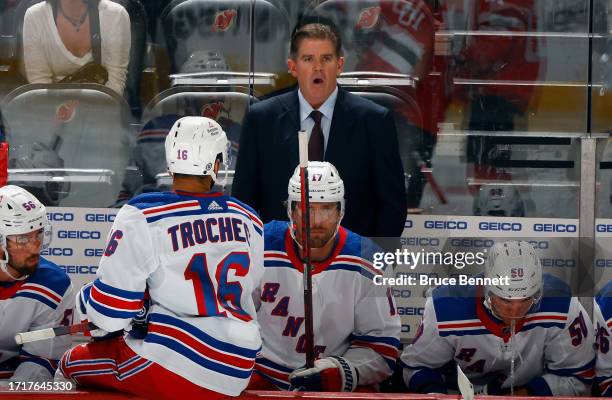 Head coach Peter Laviolette of New York Rangers handles the bench during the game against the New Jersey Devils at Prudential Center on October 04,...