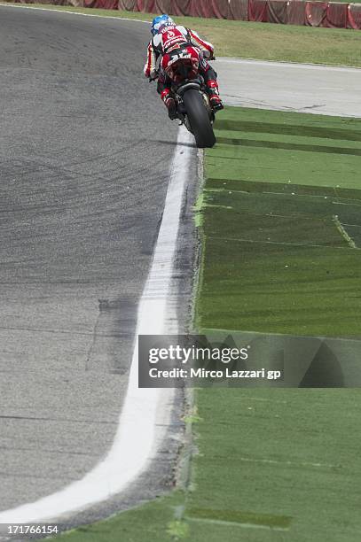 Carlos Checa of Spain and Team Ducati Alstare heads down a straight during World Superbikes - Practice during round seven of 2013 Superbike FIM World...