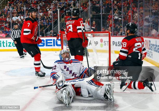 Nico Hischier of New Jersey Devils scores a second period goal against Jonathan Quick of New York Rangers at Prudential Center on October 04, 2023 in...