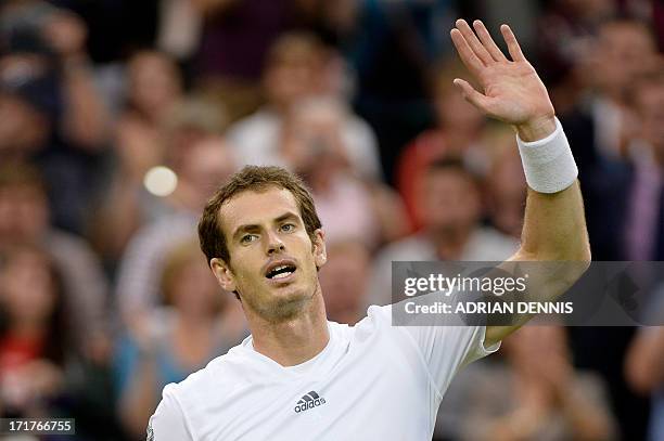 Britain's Andy Murray celebrates beating Spain's Tommy Robredo during their third round men's singles match on day five of the 2013 Wimbledon...