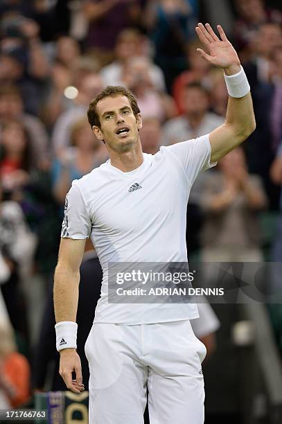 Britain's Andy Murray celebrates beating Spain's Tommy Robredo during their third round men's singles match on day five of the 2013 Wimbledon...