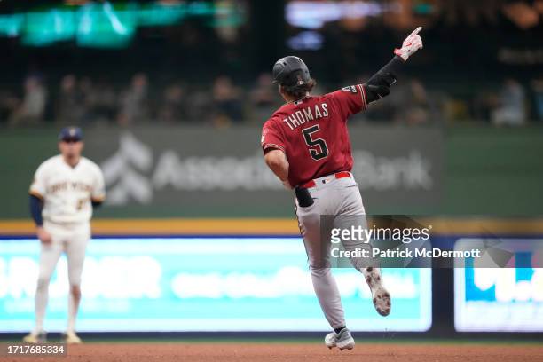 Alek Thomas of the Arizona Diamondbacks hits a solo home run during the fifth inning against the Milwaukee Brewers in Game Two of the Wild Card...