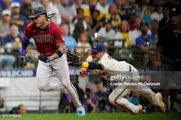 Josh Donaldson of the Milwaukee Brewers tags out Ketel Marte of the Arizona Diamondbacks during the sixth inning in Game Two of the Wild Card Series...