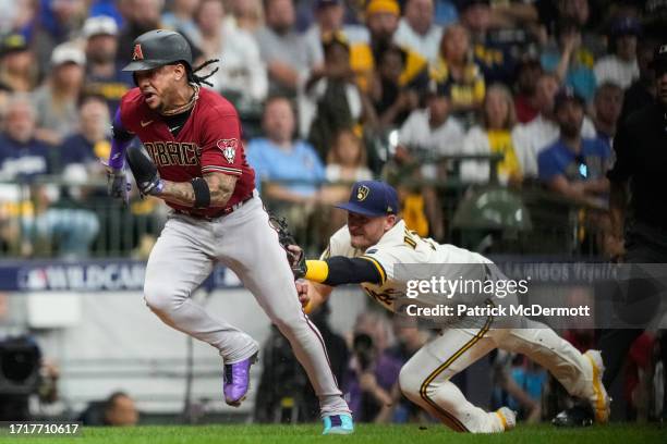 Josh Donaldson of the Milwaukee Brewers tags out Ketel Marte of the Arizona Diamondbacks during the sixth inning in Game Two of the Wild Card Series...