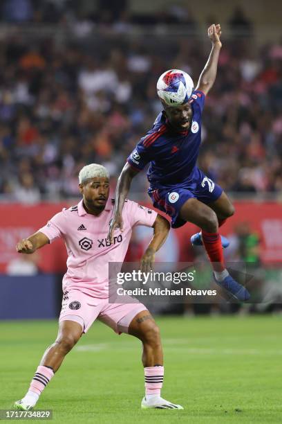 Ousmane Doumbia of Chicago Fire FC heads the ball against Josef Martínez of Inter Miami CF during the first half at Soldier Field on October 04, 2023...