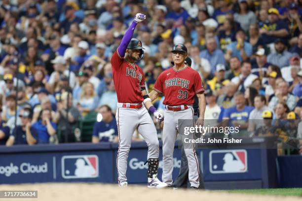 Lourdes Gurriel Jr. #12 of the Arizona Diamondbacks hits an RBI single during the sixth inning against the Milwaukee Brewers in Game Two of the Wild...