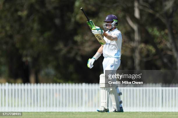Daniel Hughes of New South Wales celebrates after scoring a half century during the Sheffield Shield match between New South Wales and Queensland at...