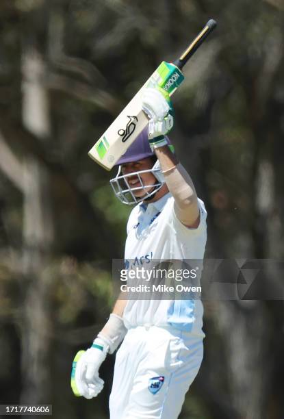 Daniel Hughes of New South Wales celebrates after scoring a half century during the Sheffield Shield match between New South Wales and Queensland at...