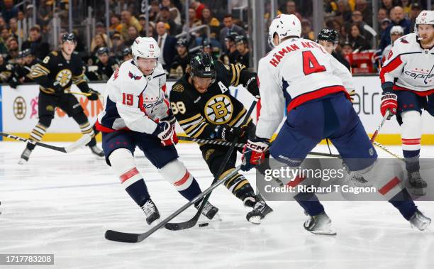 David Pastrnak of the Boston Bruins battles against Nicklas Backstrom of the Washington Capitals during the first period of a preseason game at the...