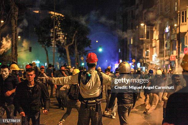 Protestor stands in the crowd in Harbiye, next to Taksim Square, during the riots after Gezi Park eviction.