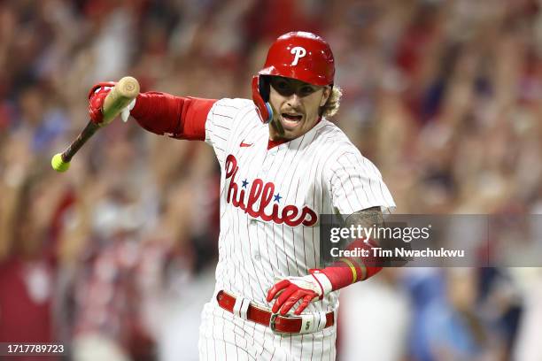 Bryson Stott of the Philadelphia Phillies celebrates after hitting a grand slam during the sixth inning against the Miami Marlins in Game Two of the...