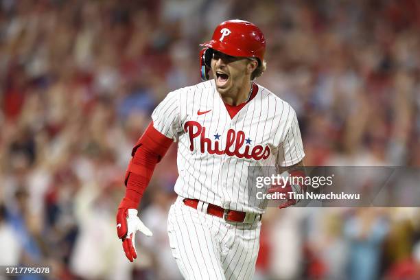 Bryson Stott of the Philadelphia Phillies celebrates after hitting a grand slam during the sixth inning against the Miami Marlins in Game Two of the...