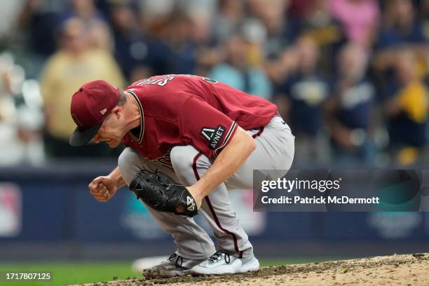 Paul Sewald of the Arizona Diamondbacks reacts to defeating the Milwaukee Brewers 5-2 in Game Two of the Wild Card Series at American Family Field on...