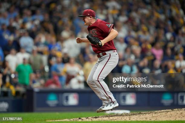 Paul Sewald of the Arizona Diamondbacks reacts to defeating the Milwaukee Brewers 5-2 in Game Two of the Wild Card Series at American Family Field on...