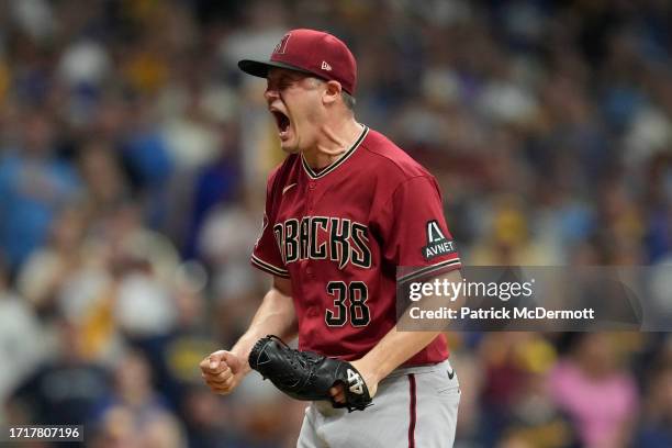 Paul Sewald of the Arizona Diamondbacks reacts to defeating the Milwaukee Brewers 5-2 in Game Two of the Wild Card Series at American Family Field on...