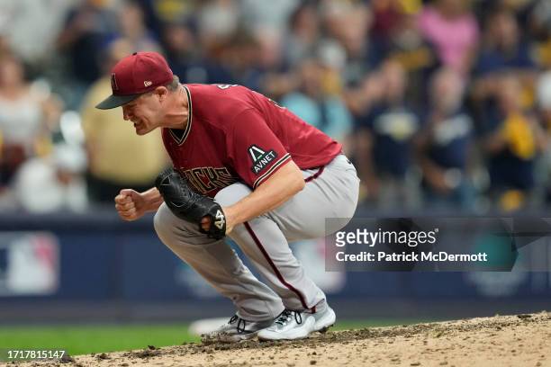 Paul Sewald of the Arizona Diamondbacks reacts to defeating the Milwaukee Brewers 5-2 in Game Two of the Wild Card Series at American Family Field on...