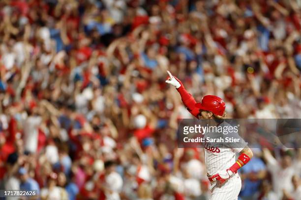 Bryson Stott of the Philadelphia Phillies runs the bases after hitting a grand slam during the sixth inning against the Miami Marlins in Game Two of...