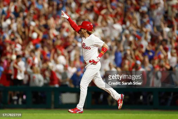 Bryson Stott of the Philadelphia Phillies runs the bases after hitting a grand slam during the sixth inning against the Miami Marlins in Game Two of...