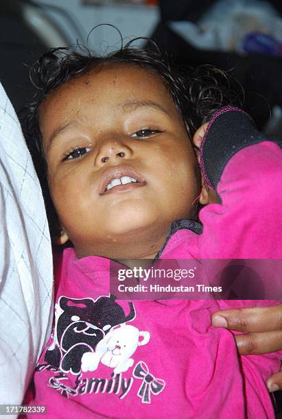 Little girl who was rescued from Kedarnath at Doon district hospital on June 28, 2013 in Dehradun, India. So far more than 1 lakh stranded people...