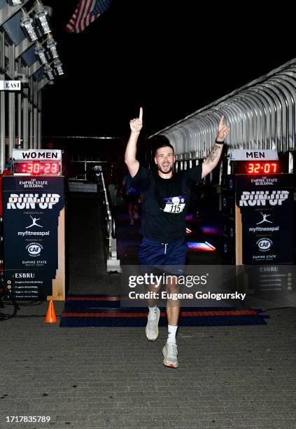 Vinny Guadagnino crosses the finish line at the 45th Annual Empire State Building Run-Up presented by MyFitnessPal and powered by the Challenged...