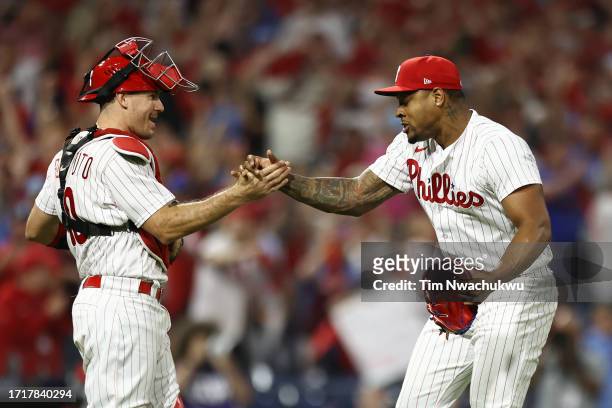 Realmuto of the Philadelphia Phillies celebrates with Gregory Soto after defeating the Miami Marlins 7-1 in Game Two of the Wild Card Series at...