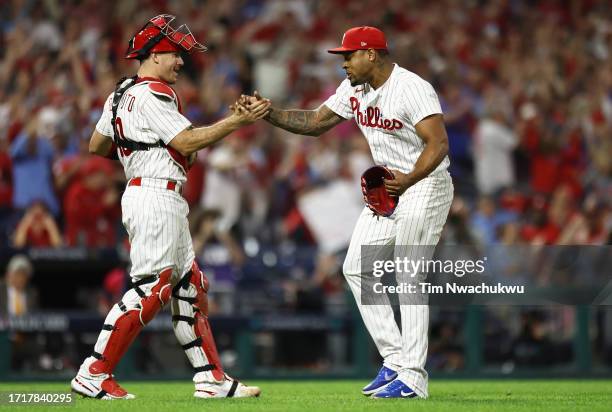 Realmuto of the Philadelphia Phillies celebrates with Gregory Soto after defeating the Miami Marlins 7-1 in Game Two of the Wild Card Series at...