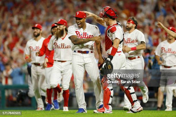 Gregory Soto of the Philadelphia Phillies celebrates with J.T. Realmuto after defeating the Miami Marlins 7-1 in Game Two of the Wild Card Series at...