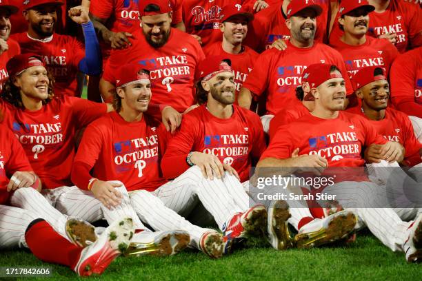 Alec Bohm, Bryson Stott, Bryce Harper, and J.T. Realmuto of the Philadelphia Phillies pose for a picture after defeating the Miami Marlins 7-1 in...