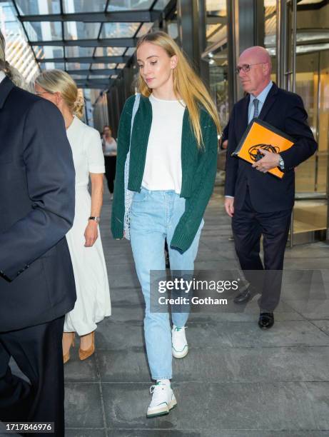 Sophie Turner departs a building on October 04, 2023 in New York City.