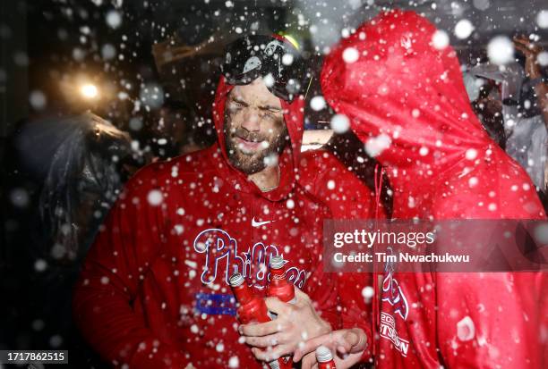 Bryce Harper of the Philadelphia Phillies celebrates in the clubhouse after defeating the Miami Marlins 7-1 in Game Two of the Wild Card Series at...