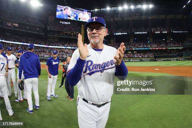 Manager Bruce Bochy of the Texas Rangers celebrates the team's win over the Baltimore Orioles in Game 3 of the Division Series at Globe Life Field on...