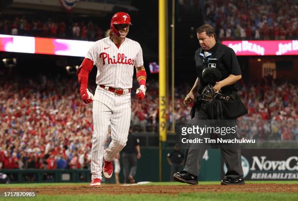 Bryson Stott of the Philadelphia Phillies scores after hitting a grand slam during the sixth inning against the Miami Marlins in Game Two of the Wild...