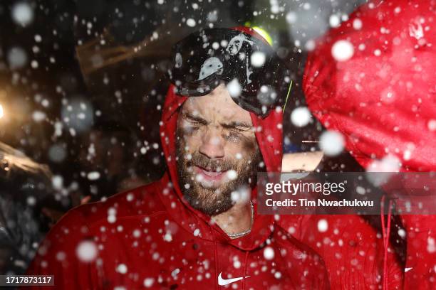 Bryce Harper of the Philadelphia Phillies celebrates in the clubhouse after defeating the Miami Marlins 7-1 in Game Two of the Wild Card Series at...