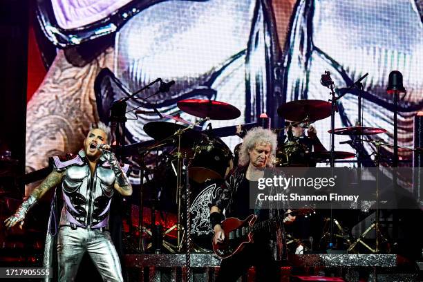 Singer Adam Lambert, guitarist Brian May, and drummer Roger Taylor perform onstage as Queen + Adam Lambert kick off the "Rhapsody Tour" at CFG Bank...