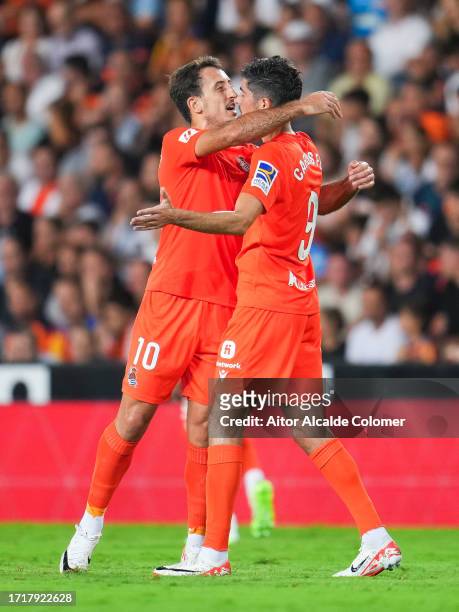 Carlos Fernandez of Real Sociedad celebrates after scoring the team's first goal during the LaLiga EA Sports match between Valencia CF and Real...