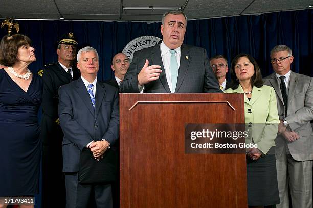 Boston Police Commissioner Edward Davis spoke to the media. From left in the back: Middlesex District Attorney Marian T. Ryan, Watertown Chief of...