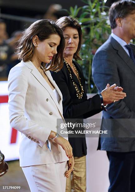 Charlotte Casiraghi and her mother Princess Caroline of Hanover stand during the podium ceremony at the 2013 Monaco International Jumping as part of...