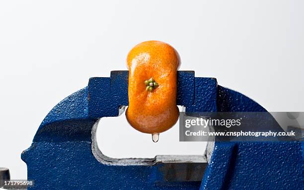 orange squeeze - vice grip stock pictures, royalty-free photos & images