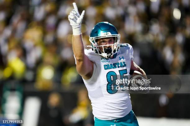 Kendall Karr of the Coastal Carolina Chanticleers celebrates after scoring a touchdown during a football game against the Appalachian State...