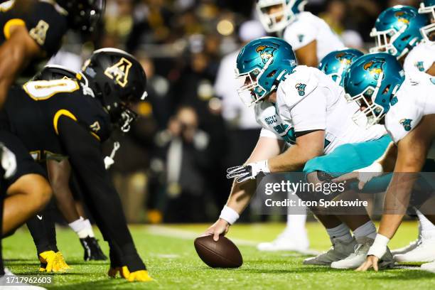 The Coastal Carolina Chanticleers offense lines ups cross from the Appalachian State Mountaineers defense during a football game at Kidd Brewer...
