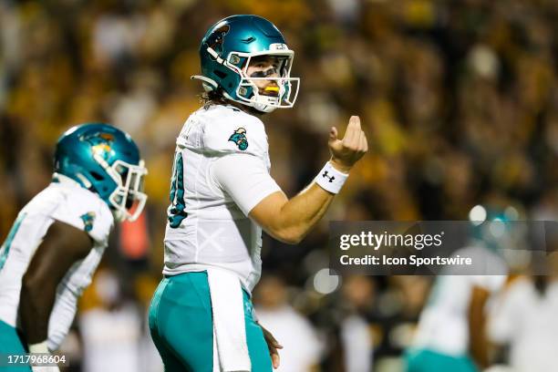 Grayson McCall of the Coastal Carolina Chanticleers signals for a play during a football game against the Appalachian State Mountaineers at Kidd...