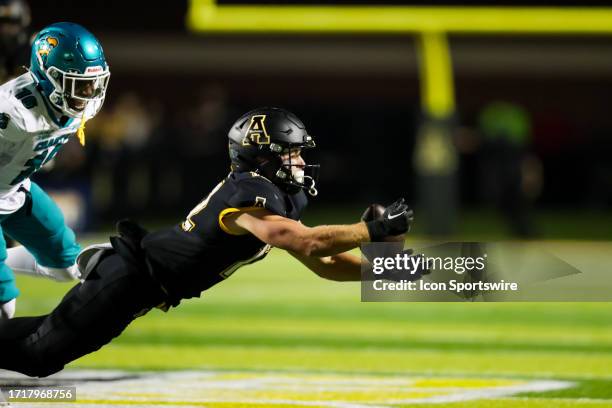 Michael Hetzel of the Appalachian State Mountaineers attempts to catch the ball during a football game against the Coastal Carolina Chanticleers at...