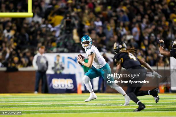 Grayson McCall of the Coastal Carolina Chanticleers looks to pass the ball during a football game against the Appalachian State Mountaineers at Kidd...