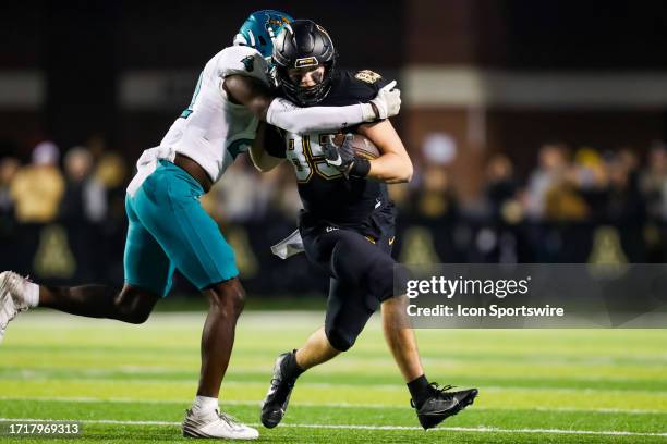 David Larkins of the Appalachian State Mountaineers runs the ball during a football game against the Coastal Carolina Chanticleers at Kidd Brewer...