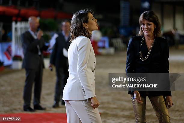 Charlotte Casiraghi and her mother Princess Caroline of Hanover stand during the podium ceremony at the 2013 Monaco International Jumping as part of...